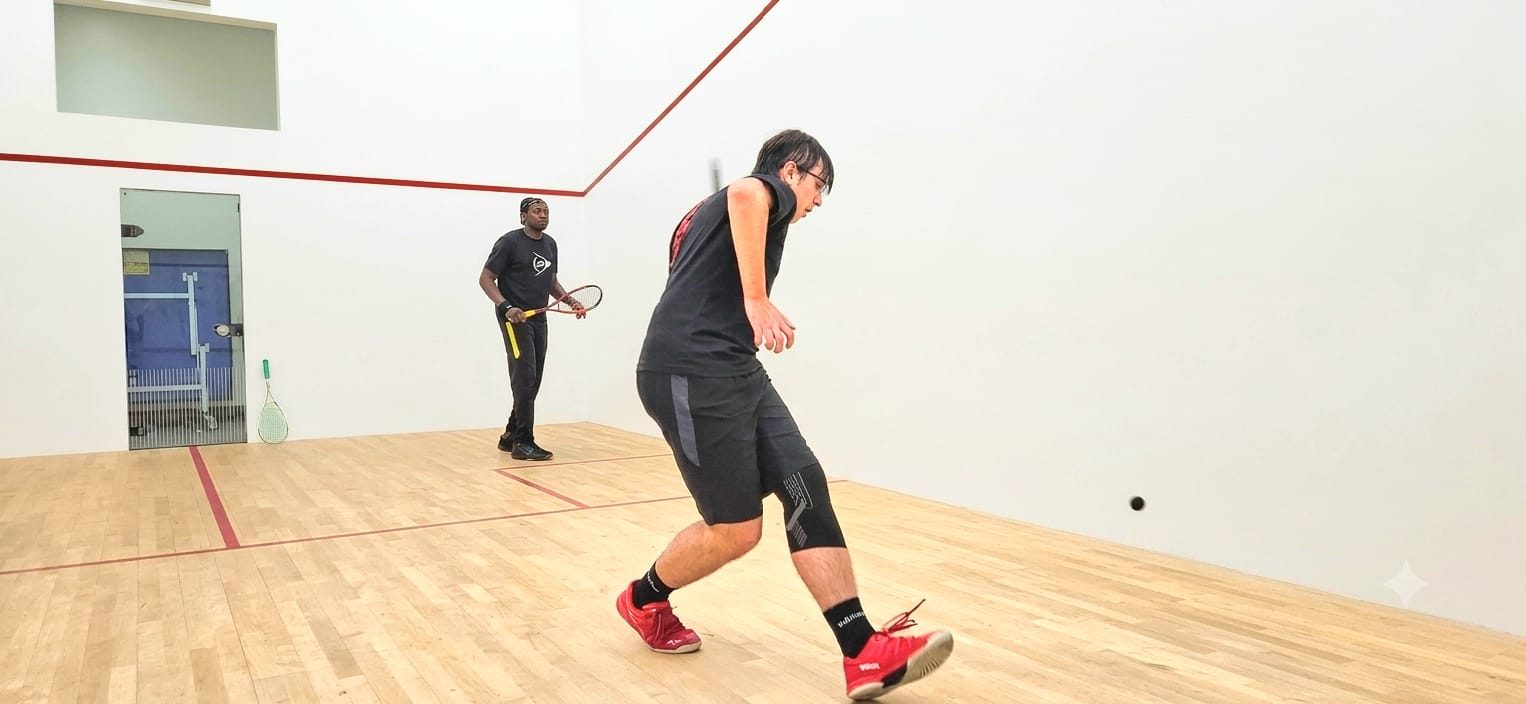 Junior player mid-rally during a coaching session